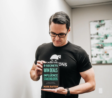 Mark holding book for picture