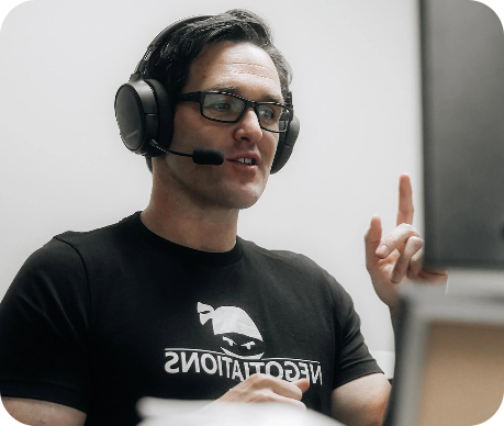 Mark talking to customers using headphone